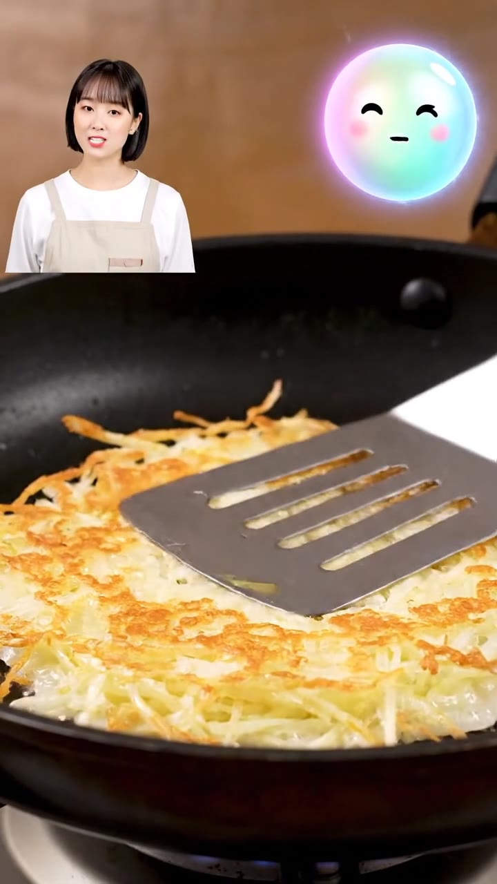 Frying the crispy Korean gamja jeon savory potato pancakes